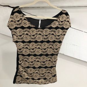 Black and gold patterned women’s top